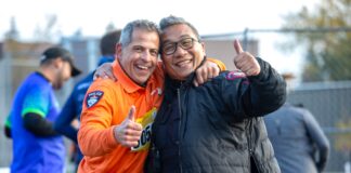 Two people pose for a photo at the Calgary Police Classic Run YYC