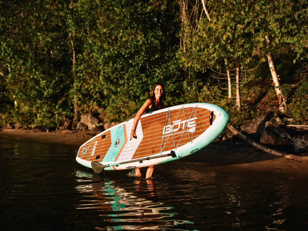 Karley Stevenson of Wolf SUP Yoga in Haliburton County Ontario takes her paddle board out onto the water to do paddleboarding yoga